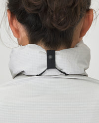 The close-fitting hood can be worn under the helmet or simply stowed in the collar.
